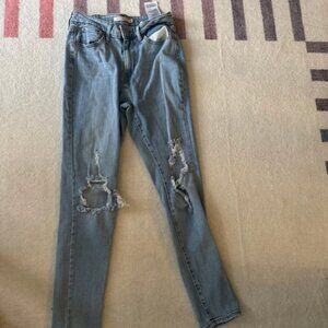 Levi’s 721 high rise skinny size 27 medium wash destroyed jeans